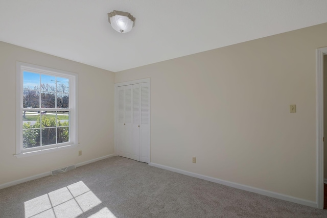 518 Hemingway Dr, Columbia, TN 38401 - unfurnished bedroom featuring light carpet and a closet