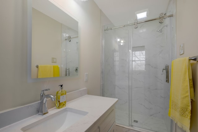 bathroom featuring vanity and an enclosed shower