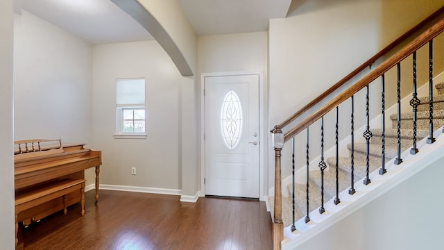 foyer entrance with dark hardwood / wood-style floors