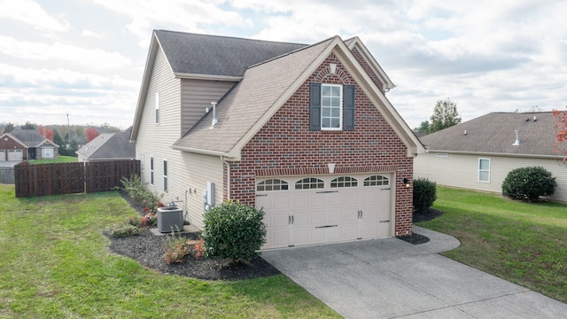 view of home's exterior with central air condition unit, a garage, and a lawn