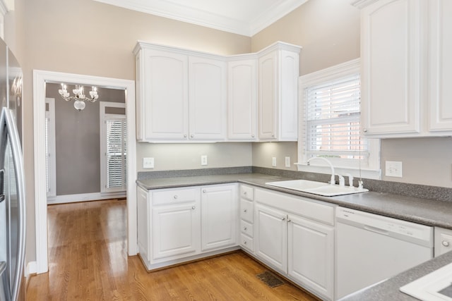 kitchen featuring white dishwasher, white cabinetry, and light hardwood / wood-style flooring