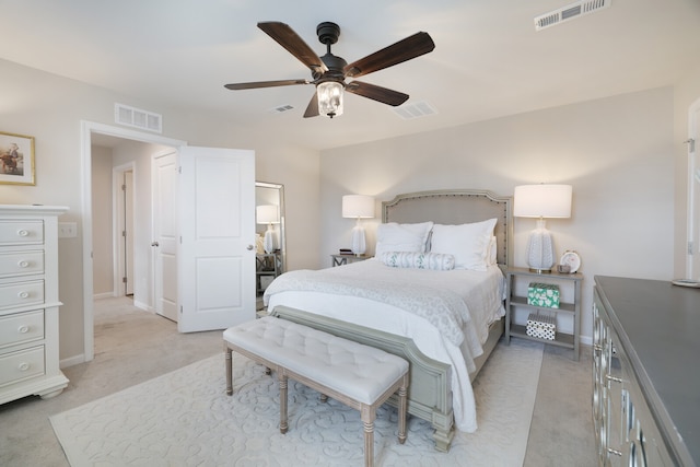 bedroom featuring light carpet and ceiling fan