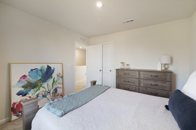 carpeted bedroom with a closet