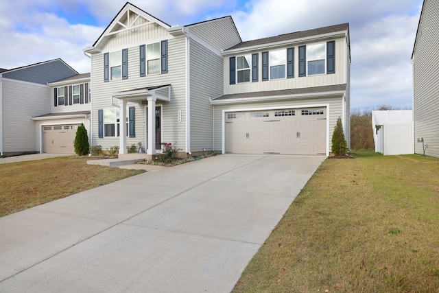 view of front of home featuring a garage and a front lawn