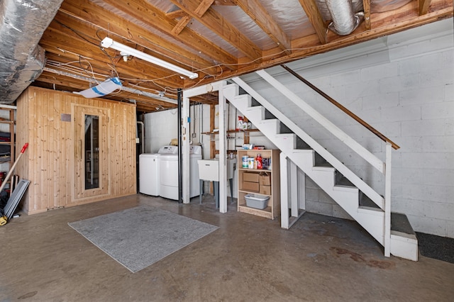 basement with washer and clothes dryer