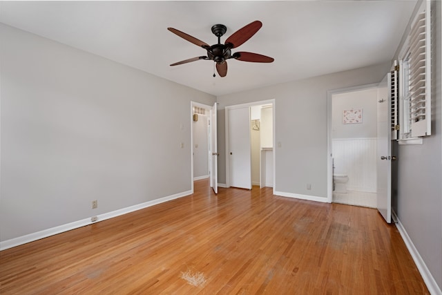 unfurnished bedroom featuring ceiling fan, light hardwood / wood-style floors, and ensuite bath