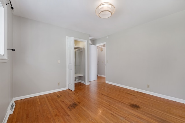 unfurnished bedroom featuring light wood-type flooring