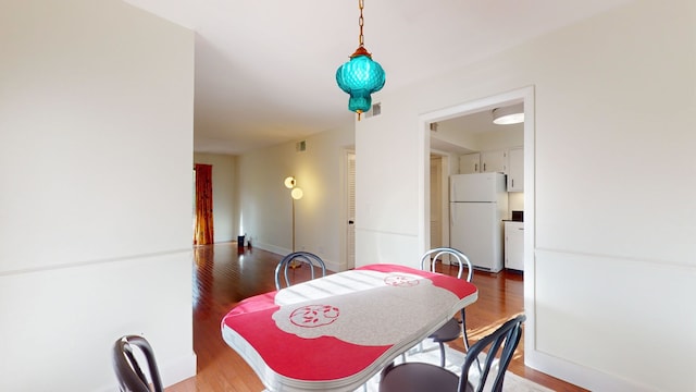 dining area featuring hardwood / wood-style flooring