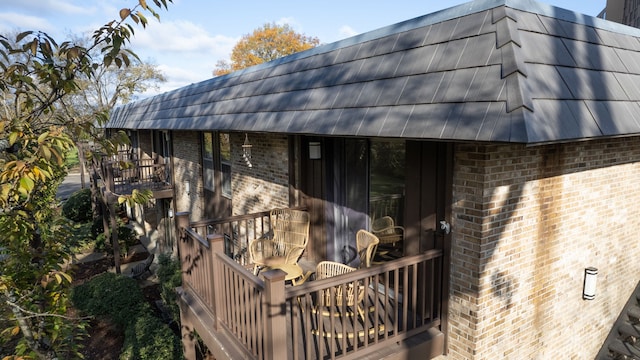 view of side of property featuring a deck