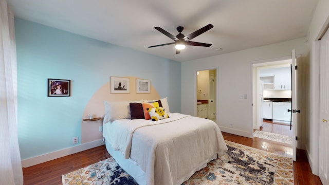 bedroom featuring ceiling fan, connected bathroom, and dark hardwood / wood-style flooring