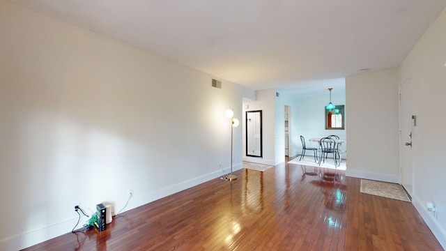 empty room with hardwood / wood-style floors