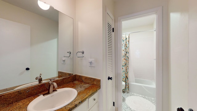 full bathroom with shower / tub combo with curtain, vanity, toilet, and tile patterned flooring