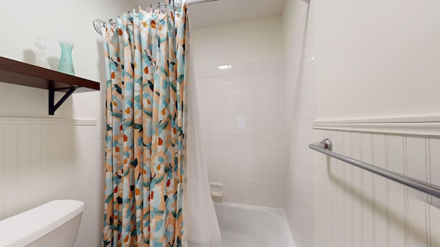 bathroom with toilet and shower / bathtub combination with curtain