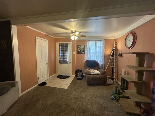 interior space featuring ceiling fan, light colored carpet, and ornamental molding