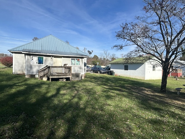 back of house with a lawn