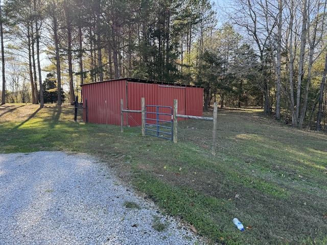 view of outdoor structure with a lawn