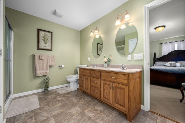 bathroom with toilet and vanity