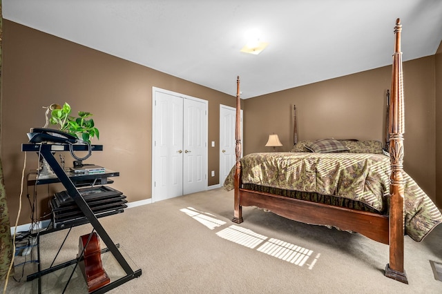 carpeted bedroom with two closets