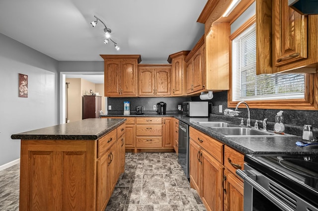 kitchen with appliances with stainless steel finishes, extractor fan, a kitchen island, decorative backsplash, and sink