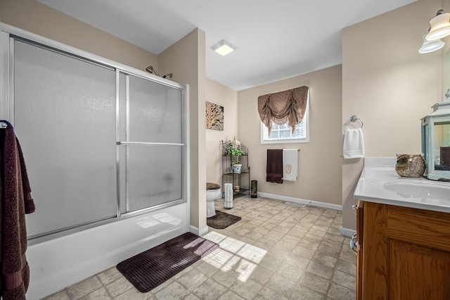 full bathroom with toilet, vanity, and combined bath / shower with glass door