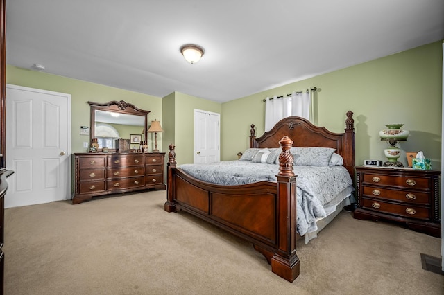 carpeted bedroom with a closet