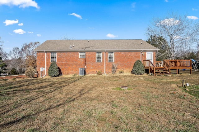 back of house featuring a wooden deck, cooling unit, and a yard