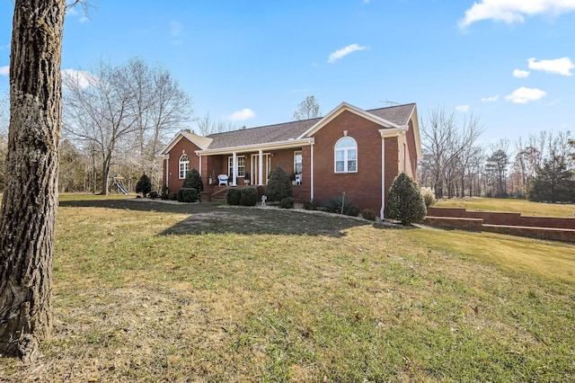 ranch-style house featuring a front yard and a porch