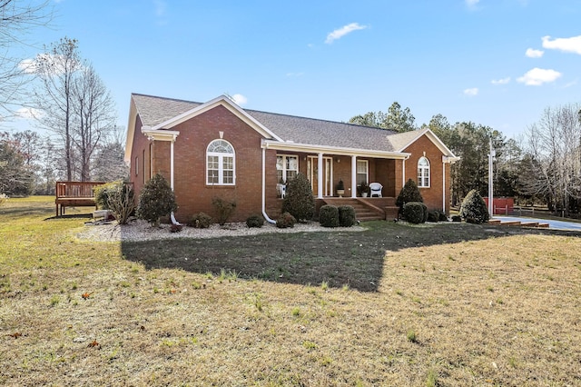 ranch-style house with a front lawn and a porch