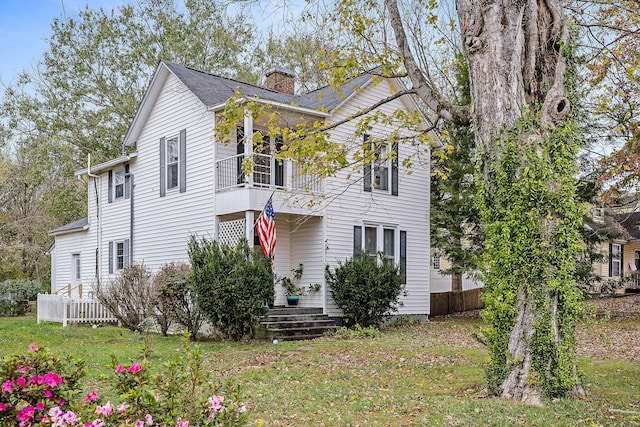 view of front of home with a balcony