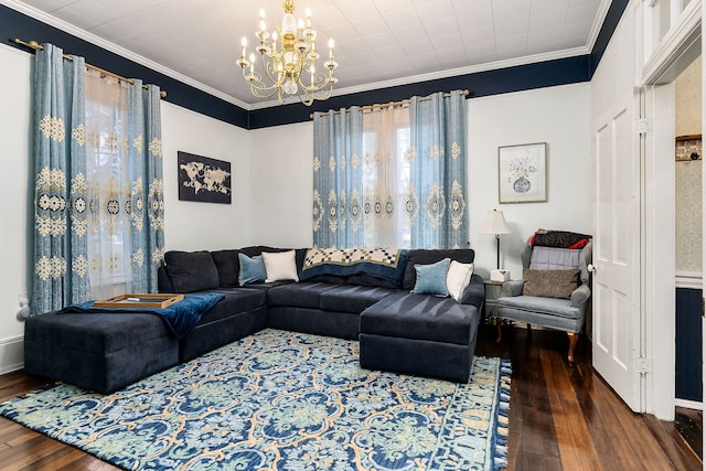 living room featuring crown molding, a chandelier, and dark hardwood / wood-style floors