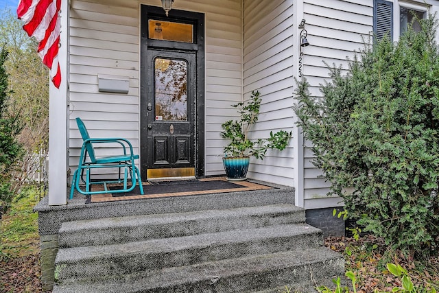 view of exterior entry featuring a porch