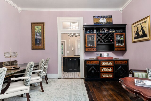 bar featuring dark hardwood / wood-style floors and ornamental molding