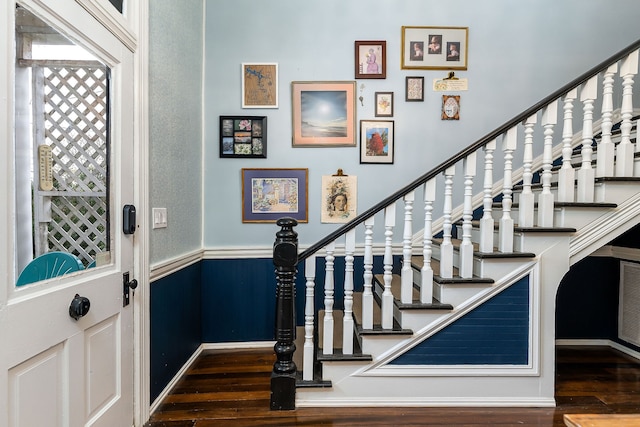 foyer entrance with dark wood-type flooring