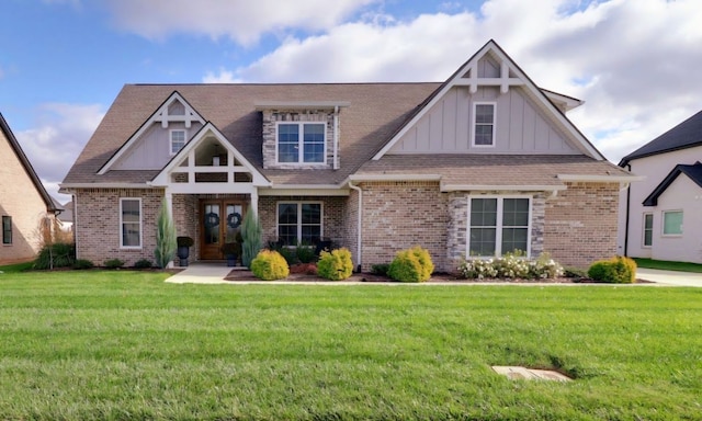 craftsman-style home with a front yard and french doors