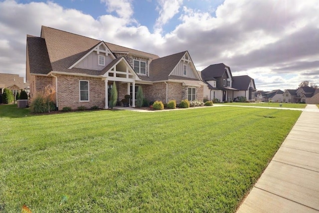 view of front of property with cooling unit and a front yard