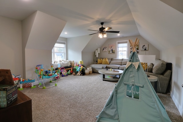 playroom with lofted ceiling, carpet floors, and ceiling fan