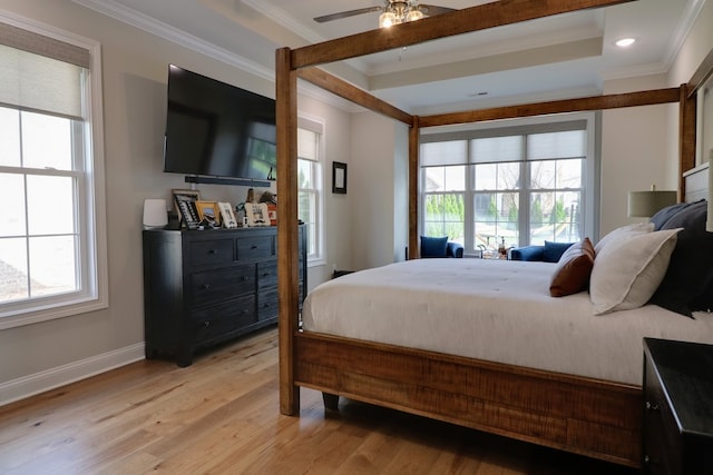 bedroom with crown molding, ceiling fan, and light hardwood / wood-style floors