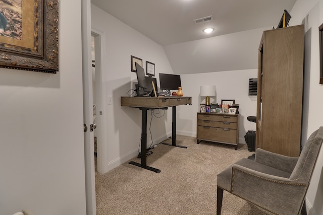 interior space with vaulted ceiling and light colored carpet