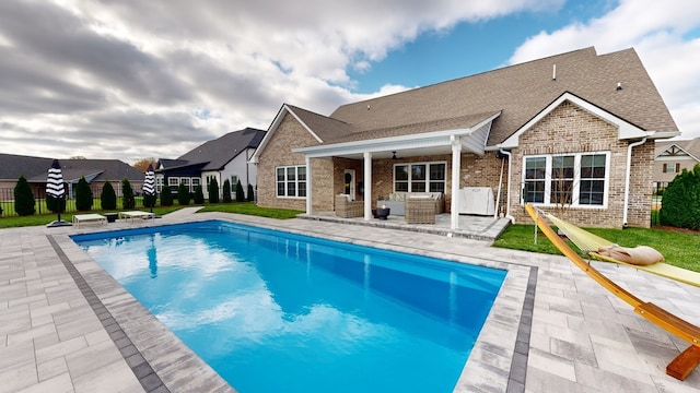 back of house with a patio and ceiling fan