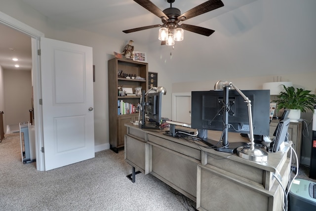 carpeted office featuring ceiling fan