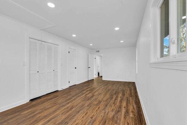 spare room with dark wood-type flooring