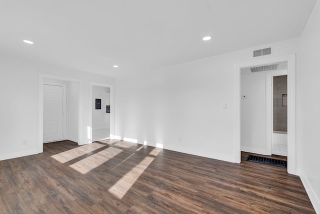 spare room featuring dark hardwood / wood-style floors