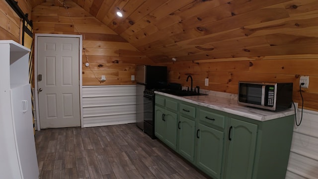 kitchen featuring wood walls, dark hardwood / wood-style floors, lofted ceiling, and green cabinetry