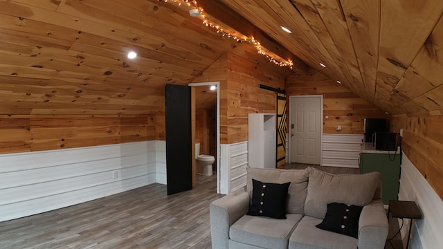 bonus room with wood walls, wood ceiling, lofted ceiling, and hardwood / wood-style flooring