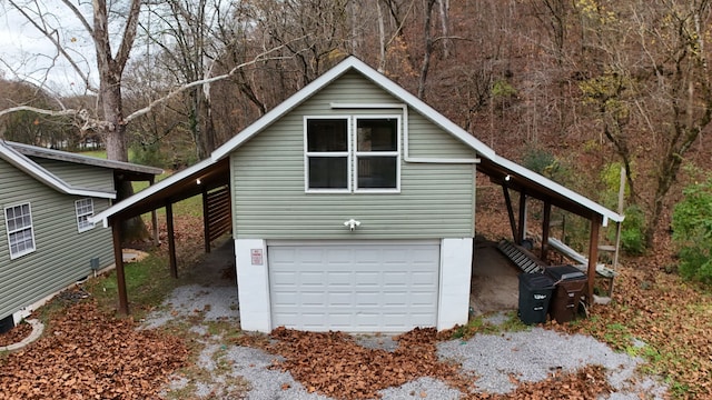 view of side of home featuring a garage