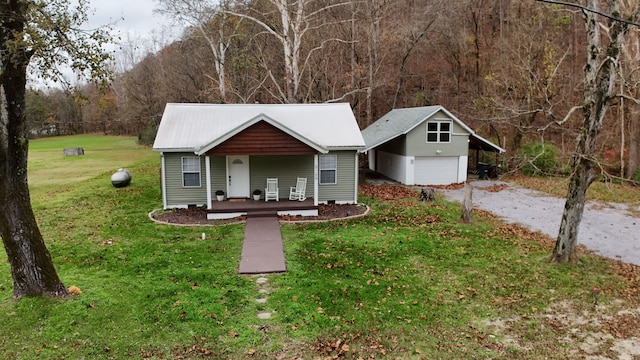 ranch-style home with covered porch and a front yard