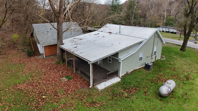 exterior space with a yard and cooling unit