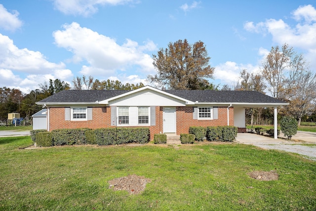 ranch-style house with a carport and a front lawn