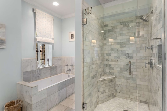 bathroom featuring tile patterned floors, separate shower and tub, and ornamental molding