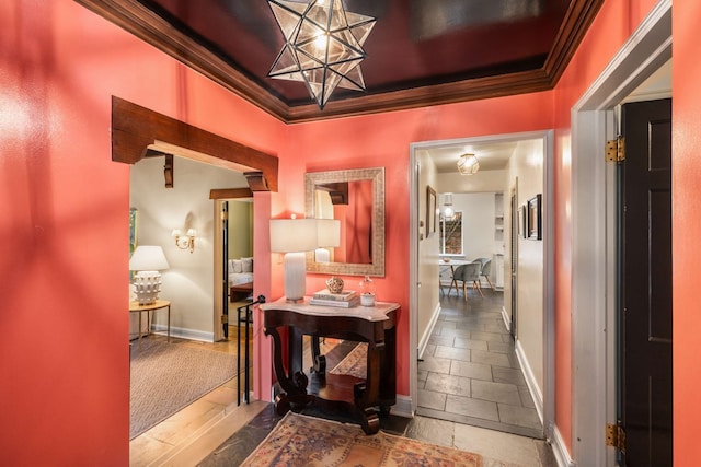 hall featuring carpet floors and ornamental molding